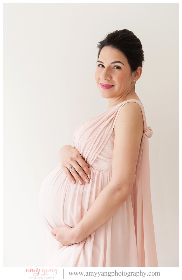 Pregnant mom wearing pink dress in charlottesville