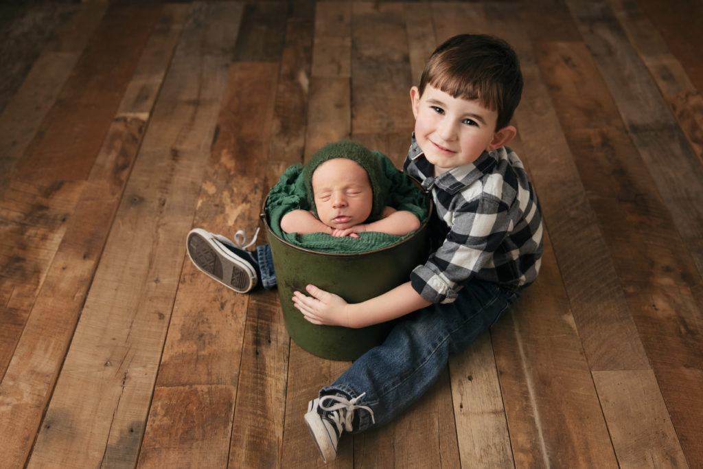 Boy with newborn brother