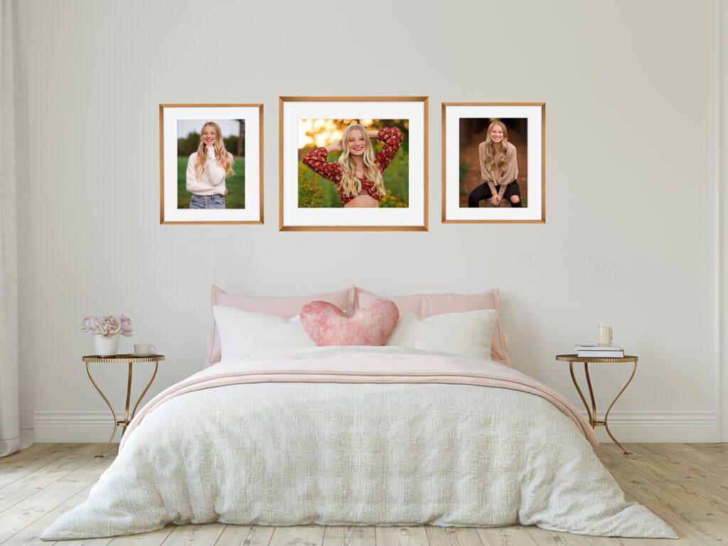 Framed senior portraits displayed above a bed, highlighting custom wall art included with senior portrait packages from a Charlottesville senior photographer.