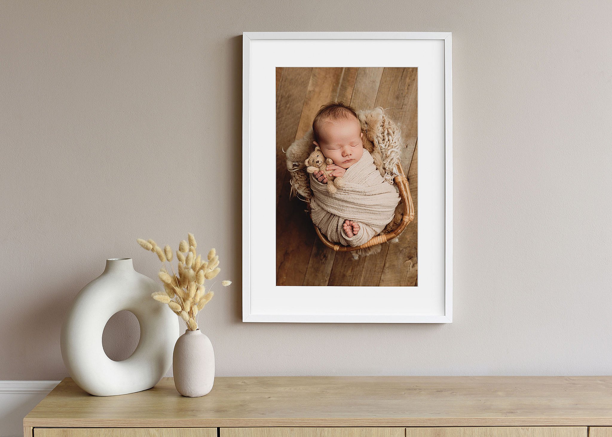 fine art print of baby wrapped and holding teddy bear by Charlottesville newborn photographer