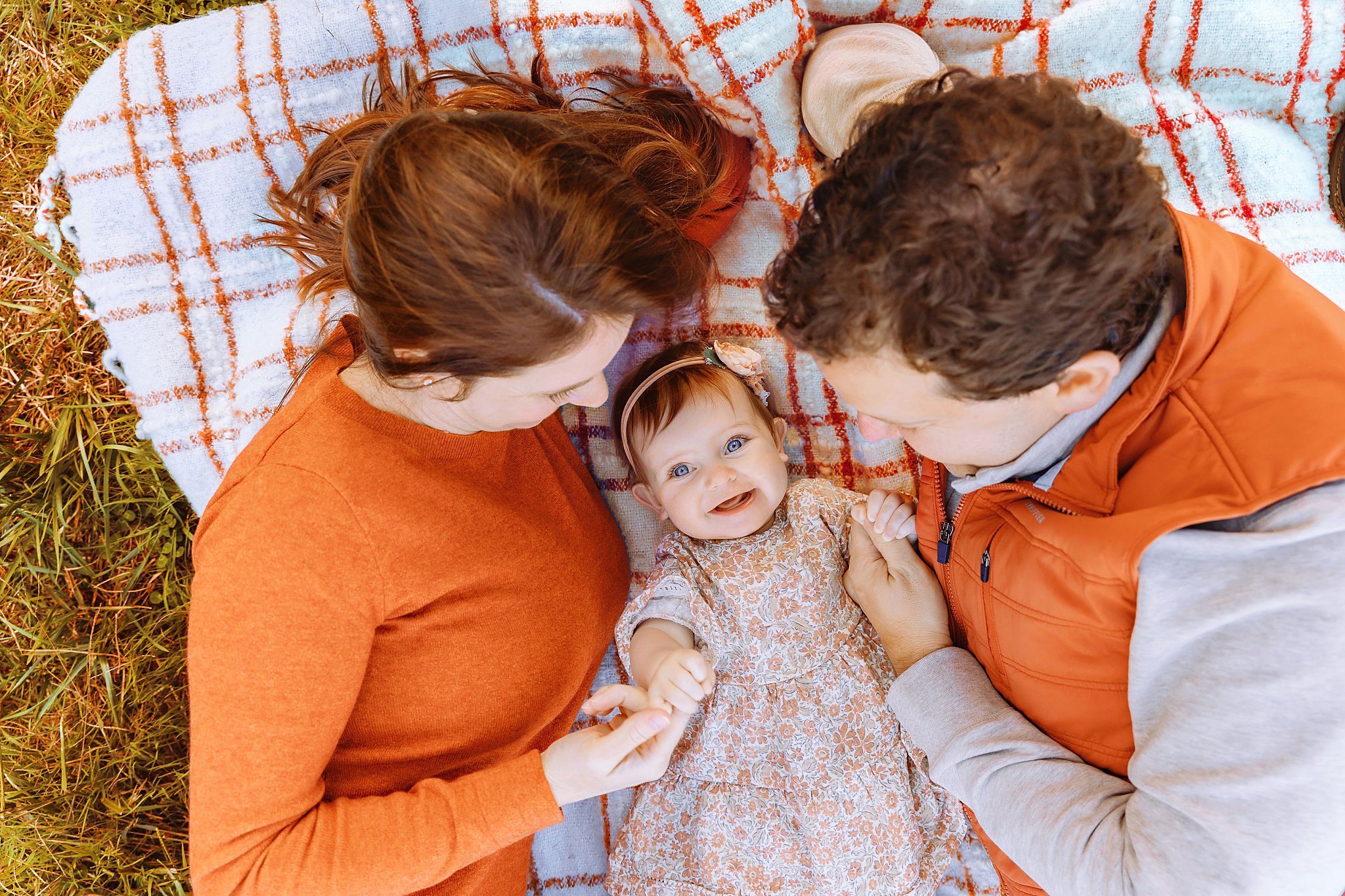 mom and dad create family memories with their baby 