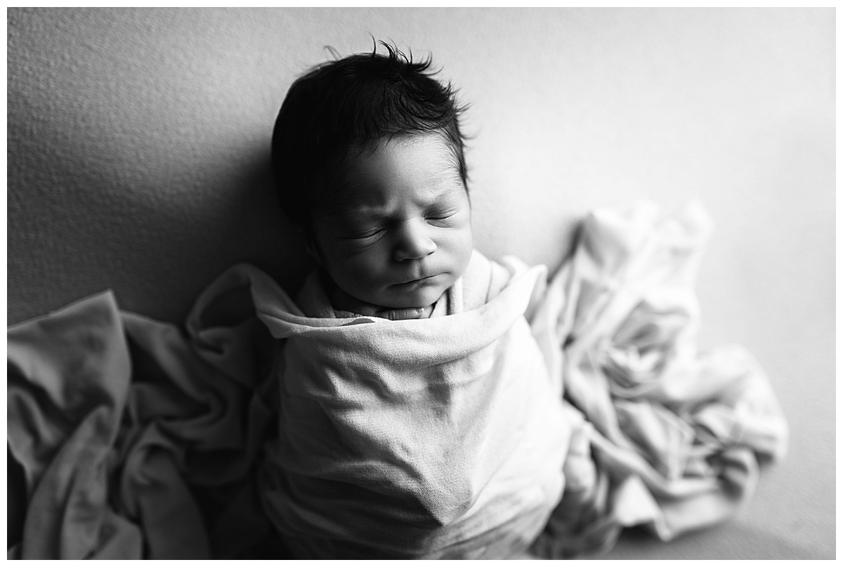 blanket draped over resting newborn by Amy Yang Photography