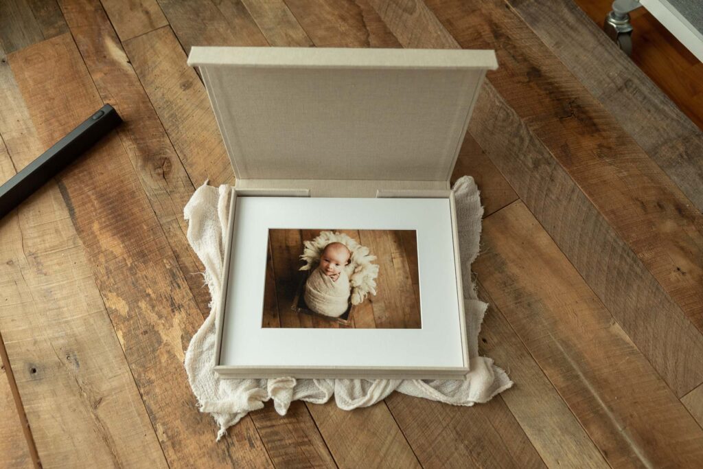 Keepsake box with newborn photo albums and fine art prints by Amy Yang Photography.
