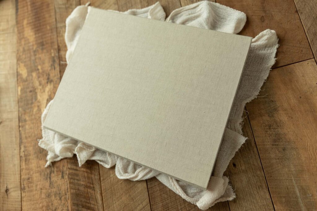 Linen keepsake box for custom newborn photo albums and prints.